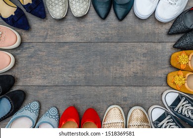too many shoes on wooden background. Fashion frame of variety women shoes, copy space, text place. Set with different types of women shoes. Fashionable Footwear Set 