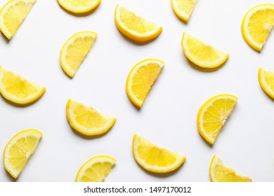 Many Slices Of Lemon On White Background