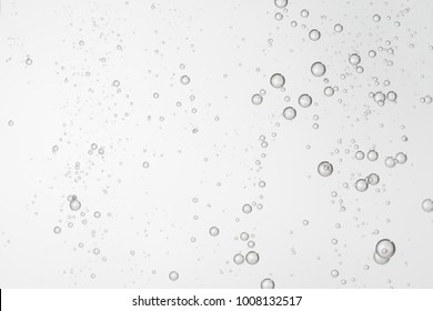 Many Small Air Bubbles Flows Over A Gray Background