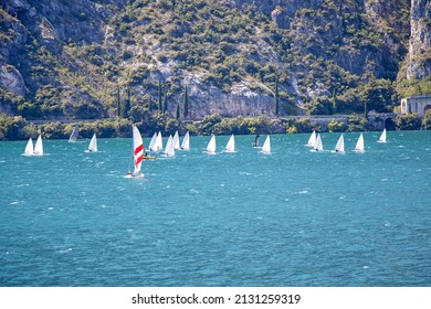 Many Small Sailboats Sail On Lake Lago Di Garda In Italy