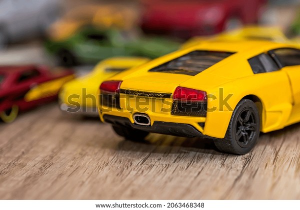 Many small toy cars on\
table