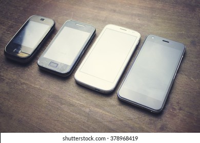 Many Smart Phones On The Wooden Table