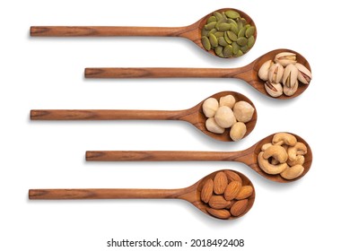 many snack nuts pumpkin seeds, pistachios, macadamia nuts, cashew nut, almond in wooden spoon on white background. Vegetarian or vegan snake. Healthy food eating. Top view - Powered by Shutterstock