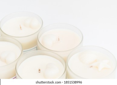 Many Soy Wax Candles Together On The White Background