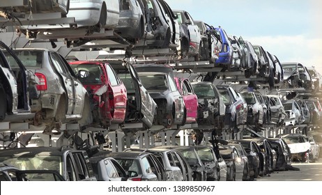 Many stacked broken cars in junkyard - Shutterstock ID 1389850967