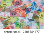 Many Swiss banknotes lie on a table. The economic crisis has intensified since UBS took over Credit Suisse.