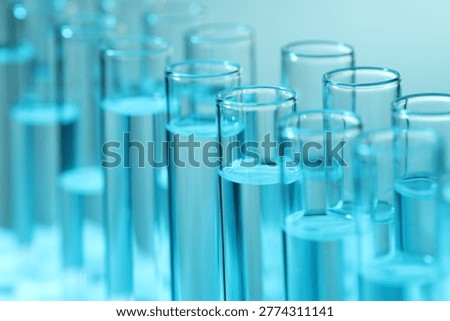 Many test tubes on light background, closeup