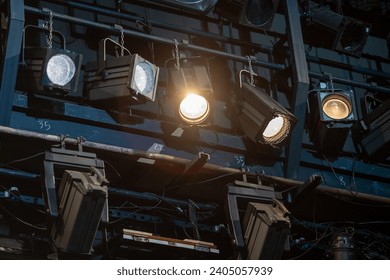 many theater spotlights above the stage