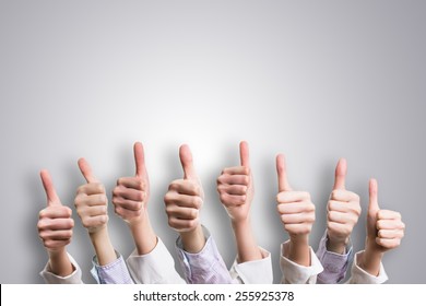many thumbs up - Shutterstock ID 255925378