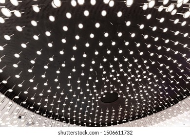 Many tiny light bulbs on a ceiling