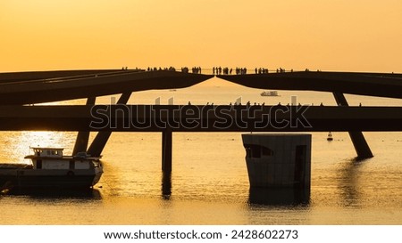 Many tourists were on a large bridge in the middle of the sea. sunset time Phu Quoc Island, Sunset Town, Vietnam
