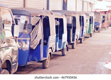 Many Tuk Tuks Align On The Side Of The Road In Sri Lanka