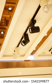 Many type of track light are mounted on the ceiling.