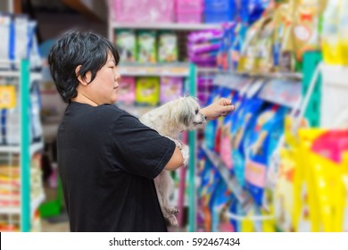 Many Types Of Pet Food (Dog, Cat And Other) On Pet Goods Shelf In Pet Shop.