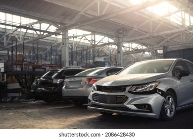 Many unknown altered wrecked car after traffic accident crash at restore service maintenance station garage indoor. Insurance salvage vehicle auction wholesale. Auto body wreck damage workshop center - Shutterstock ID 2086428430