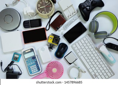many used modern Electronic gadgets for daily use on White floor, Reuse and Recycle concept, Top view. - Shutterstock ID 1457896685