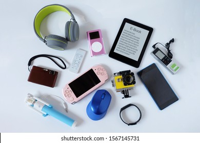Many used modern Electronic gadgets for daily use on White floor, Reuse and Recycle concept, Top view. - Shutterstock ID 1567145731