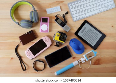 Many used modern Electronic gadgets for daily use on wooden floor, Reuse and Recycle concept, Top view. - Shutterstock ID 1567490314