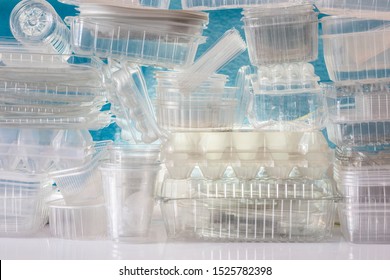 Many used plastic boxes for food packaging. Pile of disposable plastic containers for take away food.