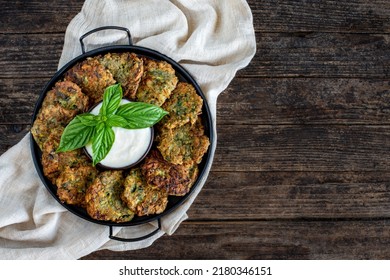 Many vegetable flitters in the plate with white sauce. mucver. Vegetarian food with fried vegetables.   - Shutterstock ID 2180346151