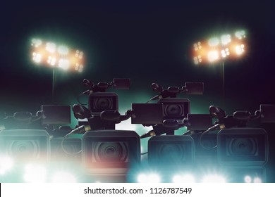 Many Video Camera Of Press And Media Reporter With Light In Stadium, Sport Channel Concept