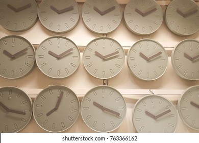 Many Wall Clocks Light Green Grey Background