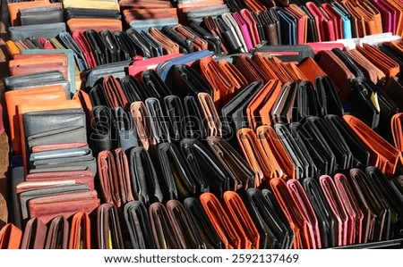 many wallets, document holders, and credit card cases in genuine leather for sale at the leather goods shop