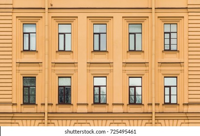 Many Windows In A Row On Facade Of Urban Office Building Front View, St. Petersburg, Russia