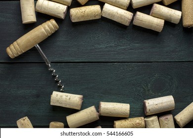 Many Wine Corks And A Vintage Cork Screw On A Dark Wooden Background Texture With Copyspace. A Horizontal Design Template For A Tasting Invitation Or Restaurant Menu