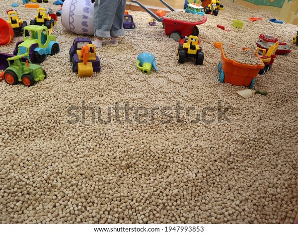 many wooden cubes with\
toy trucks in the children\'s playground design for joyful and\
creative concept