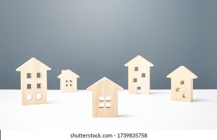 Many Wooden Figures Of Residential Buildings. Affordable Comfortable Housing. Urban Studies And Science. Good Modern Neighborhood. Search Purchase Best Option Apartment And Real Estate, Rent And Sale.