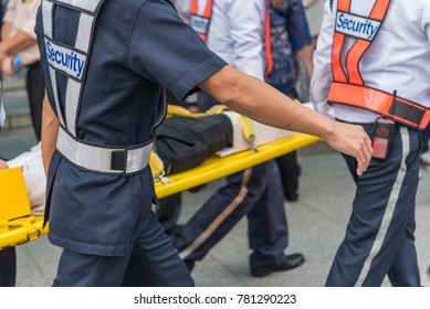 Many Working People Preparedness For Fire Drill Or Other Disaster By Move Injury Patient On Spine Board At Office In Bangkok Thailand