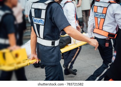 Many Working People Preparedness For Fire Drill Or Other Disaster By Move Injury Patient On Spine Board At Office In Bangkok Thailand