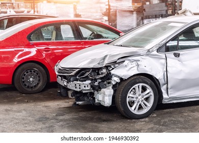 Many wrecked car after traffic accident crash at restore service maintenance station garage indoor. Insurance salvage vehicle auction wholesale storage. Auto body wreck damage work workshop center - Shutterstock ID 1946930392