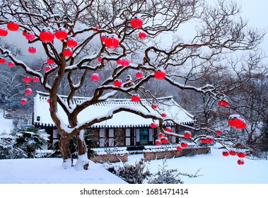Manyeonsa Temple, Hwasun-gun, Jeollanam-do, Korea - February 17, 2012: Red lotus lanterns hanging on tree with snow covered temple
