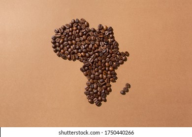 Map of Africa made with coffee beans on brown background