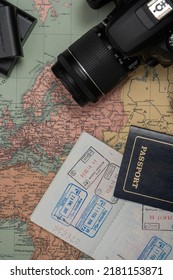 A Map Of Europe Together With A Camera And Passport With Visa Stamps. Concept Of Vacation, Travel, Travelers. Copy Space.