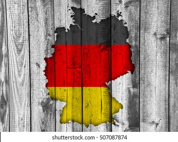 Map and flag of Germany on weathered wood