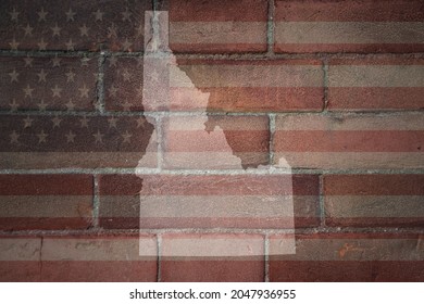 map of idaho state on a painted flag of united states of america on a old brick wall