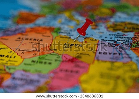 Map of Libya with a red pushpin stuck
