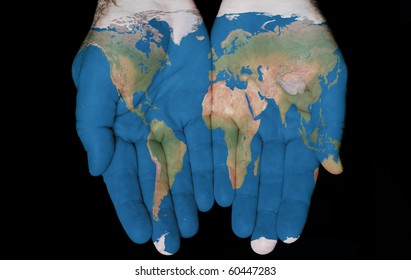 Map painted on hands showing concept of having The World in our hands