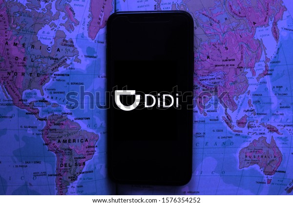 Map and smart phone with the Didi Chuxing Technology\
Co. logo, which is a transportation company.\
United States,\
California, December 2,\
2020