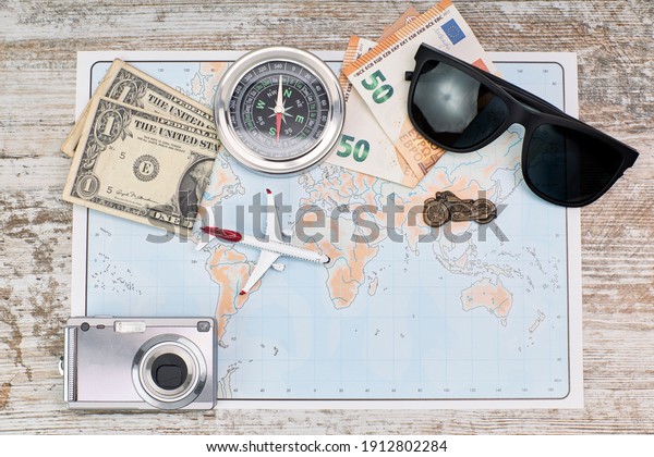 Map and traveling items. Travel planning concept\
on map. Vacation concept