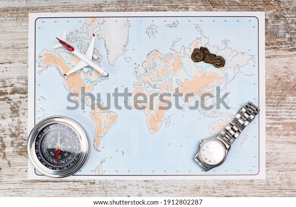 Map and traveling items. Travel planning concept\
on map. Vacation concept