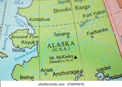 Map view of Alaska on a geographical globe.