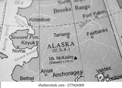 Map view of Alaska on a geographical globe. (black and white)