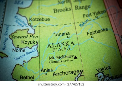 Map view of Alaska on a geographical globe. (vignette)