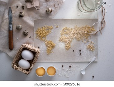 Map Of The World  Pasta On The Canvas. Flour Sieve Spices. Food, Top View