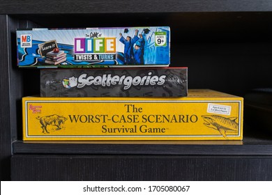 Maple Grove, Minnesota - April 15, 2020: Shelf Of Board Games Including The Game Of Life, Scattergories, And The Worst Case Scenario Game