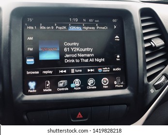 Maple Grove, MN - June 9, 2019: Car Console Display Of The Sirius XM Satellite Radio In A Jeep SUV. Screen Shows The Y2Kountry Music Station, With A Jerrod Niemann Song Playing